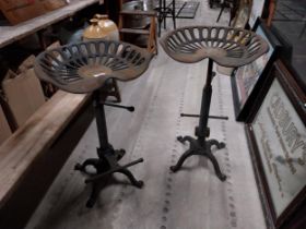 Pair of adjustable pub stools in the form of Machine Seats. {77 cm H x 46 cm W x 35 cm D}.