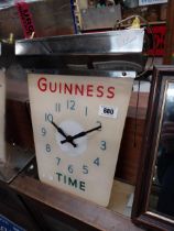 Guinness chrome and Perspex hanging battery advertising clock. {42 cm H x 44 cm W}.