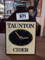 Taunton Cider Perspex battery advertising clock. {19 cm H x 12 cm W}.
