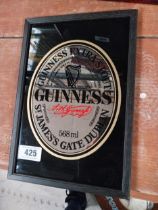 Guinness Extra Stout framed advertising mirror. {32 cm H x 22 cm W}.