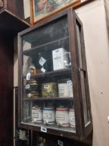 Early 20th C. mahogany wall shop display cabinet with single glazed door. {77 cm H x 51 cm W x 21 cm
