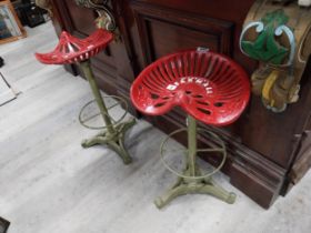 Pair of McCormack Farmall Machine Seats in the form of stools. {76 cm H x 46 cm W x 23 cm D}.