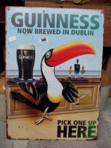 Tin plate Guinness Now Brewed in Dublin advertising sign. {50 cm H x 38 cm Dia.}.