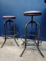 Pair of metal industrial stools with leather upholstered seats. { 78cm H X 35cm Dia }.