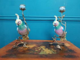 Two decorative ceramic and gilded brass candle sticks in the form of Parrots {34 cm H x 16 cm W x 16