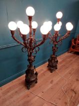 Pair of decorative bronze floor candelabras with opaline glass shades {174 cm H x 75 cm Dia.}.