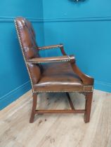 Mahogany and leather Gainsborough chair in the Georgian style {100 cm H x 70 cm W x 65 cm D}.