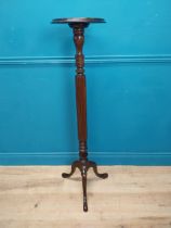 Edwardian mahogany torchere raised on turned column and three outswept feet {122 cm H x 42 cm