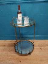 Gilded metal drinks trolly {70 cm H x 47 cm Dia.}.