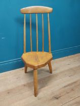 1950s pine childs chair raised on three tapered legs {74 cm H x 34 cm W x 37 cm D}.