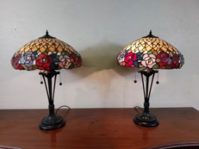 Pair of metal and stained glass lamps in the Tiffany style {66 cm H x 44 cm Dia.}.