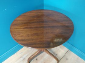 Regency mahogany lamp table raised on turned column and three outswept feet {73 cm H x 59 cm Dia.}.