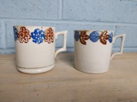 Two 19th. C. Spongeware mugs decorated with flowers & foliage { 9cm H X 12cm W }.