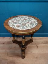 Good quality gilt and ebonised walnut centre table with platform base on three carved legs in the