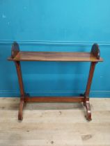 Good quality 19th C. mahogany book stand raised on reeded columns, four outswept feet and brass &