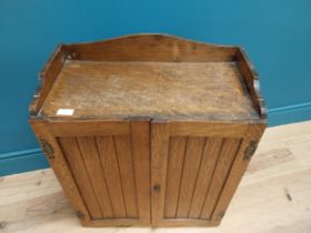 Edwardian oak wall hanging office cabinet with fitted interior. {73 cm H x 58 cm W x 29 cm D}