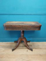 Regency rosewood and brass inlay turn over leaf card table raised on turned column, four outswept