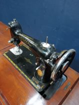 Threadle Singer sewing machine on table base. { 78cm H X 91cm L X 44cm D }