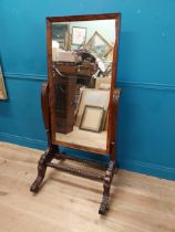 Exceptional quality Regency mahogany cheval mirror raised on barley twist supports and four outswept