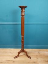 Carved mahogany torchere in the William IV style {142 cm H x 50 cm Dia.}.
