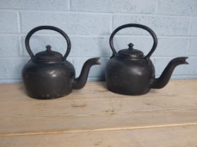 Two early 20th. C. cast iron kettles { 30cm H X 33cm W X 24cm D }.