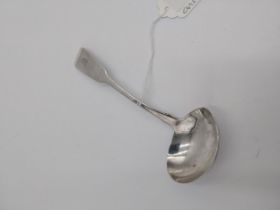 Irish Georgian silver sauce ladle, the fiddle pattern with rat tail, engraved with clam shell to