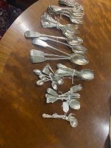 Two EPNS serving spoons stamped West & Son one with strainer, each engraved with a rampant lion