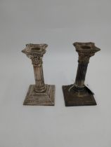 Pair of English packed silver Corinthian column candlesticks. Hallmarked in Birmingham 1909. Maker