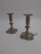 Decorative pair of Irish sterling silver candlesticks, decorated with foliage. Hallmarked in