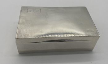 English silver cigarette box. Hallmarks rubbed. Engraved with a rectangular block enclosing a