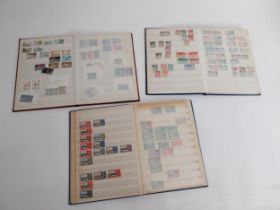 Three Books of British Commonwealth stamps 1900-1970 some over stamped with WAR TAX .