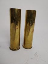 Two WWI brass shells. {21 cm H x 6 Dia.}