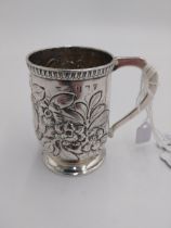 Rare Irish Georgian silver Christening mug, the body repousse - worked with flowers and foliage,