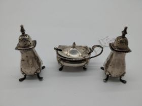 Four piece English silver cruet set - salt & pepper pots mustard pot and spoon. Hallmarked in