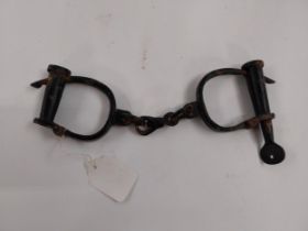 Pair of RIC handcuffs. {28 cm L}.