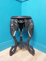 1th C. ebonised lamp table with elephant decoration. {64 cm H x 40 cm Dia.}.