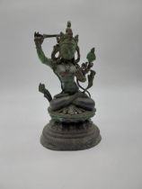 Bronze statue of Asian goddess. {30 cm H x 16 cm W x 12 cm D}.