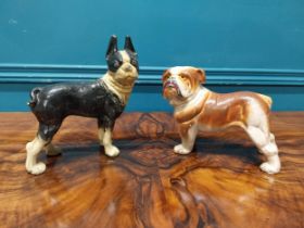 Two painted cast iron models of Dogs. {{16 cm H x 20 cm W x 12 cm D} and {20 cm H x 20 cm W x 10
