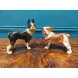 Two painted cast iron models of Dogs. {{16 cm H x 20 cm W x 12 cm D} and {20 cm H x 20 cm W x 10