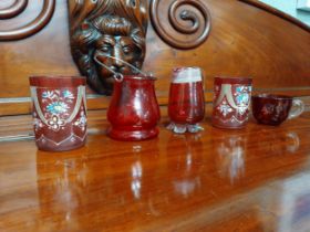 Five pieces of 19th C. ruby glass jugs and vases.