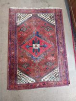 Good quality Persian rug. {160 cm L x 110 cm W}.