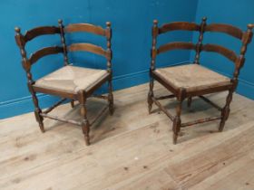 Pair of early 20th C. walnut corner chairs with rush seats {73 cm H x 60 cm W x 42 cm D}.