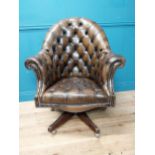 Exceptional quality hand dyed deep buttoned leather upholstered swivel office chair. {105 cm H x