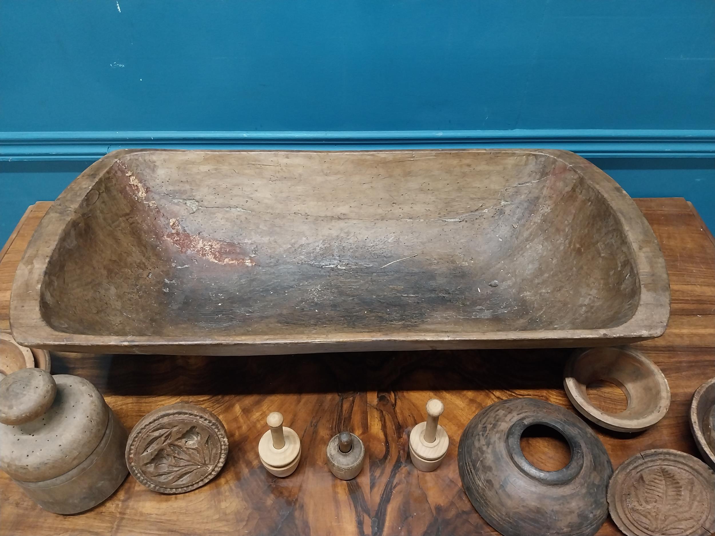 19th C. wooden dough trough and collection of butter stamps. {18 cm H x 75 cm W x 35 cm D}. - Image 5 of 5