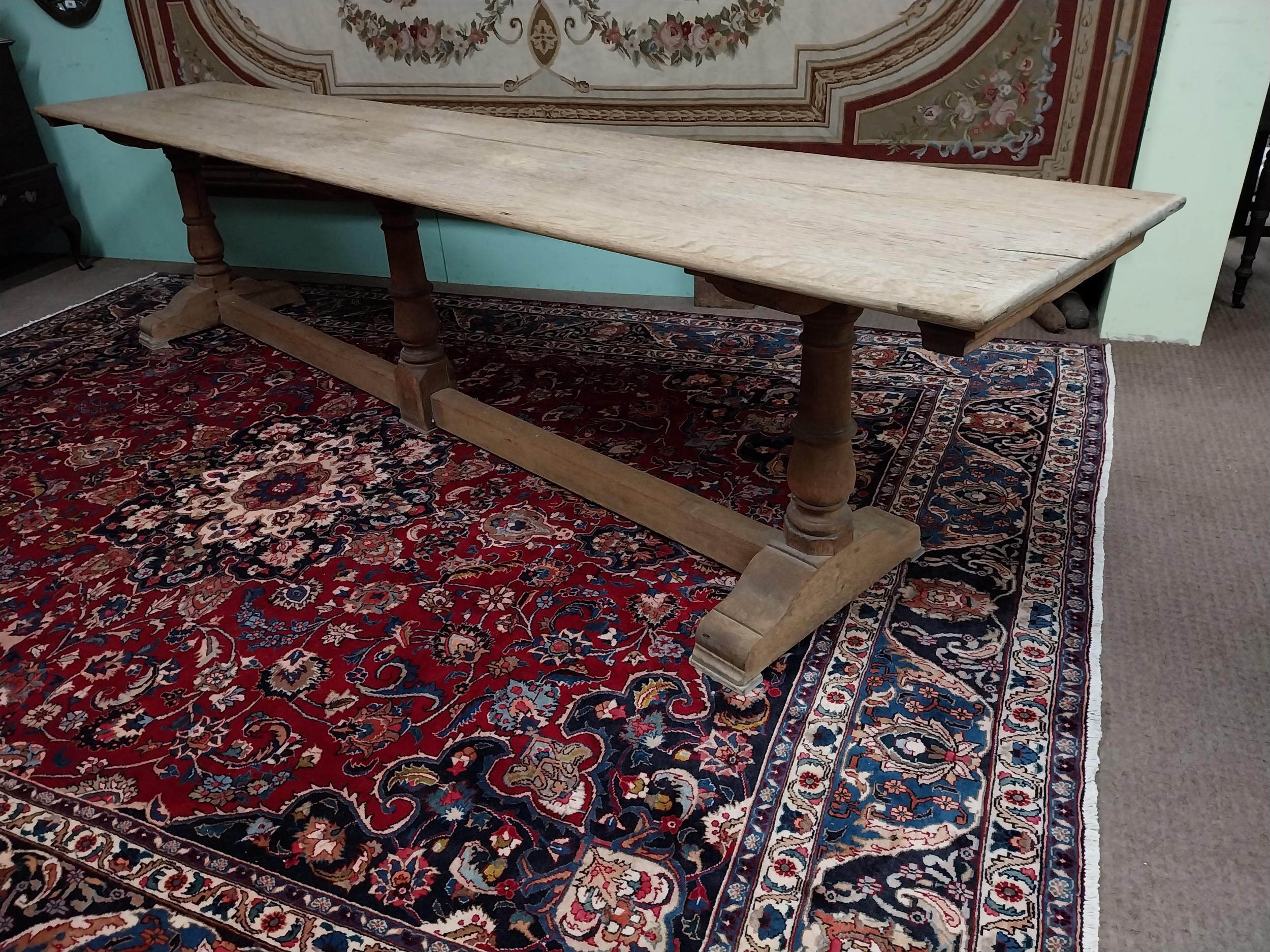 Exceptional quality bleached oak refectory table with two plank top raised on turned columns and