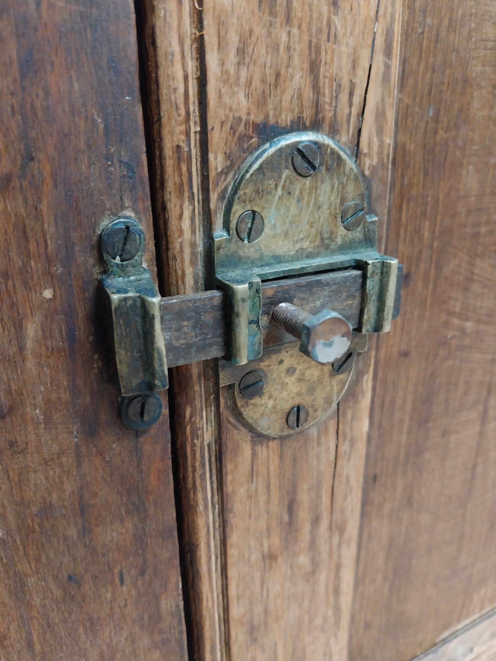 Early 20th C. oak and pine cupboard with two long doors over two short drawers on square feet. {80 - Image 7 of 9