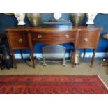 Georgian mahogany sideboard with long drawer in the frieze flanked by two deep drawers raised on