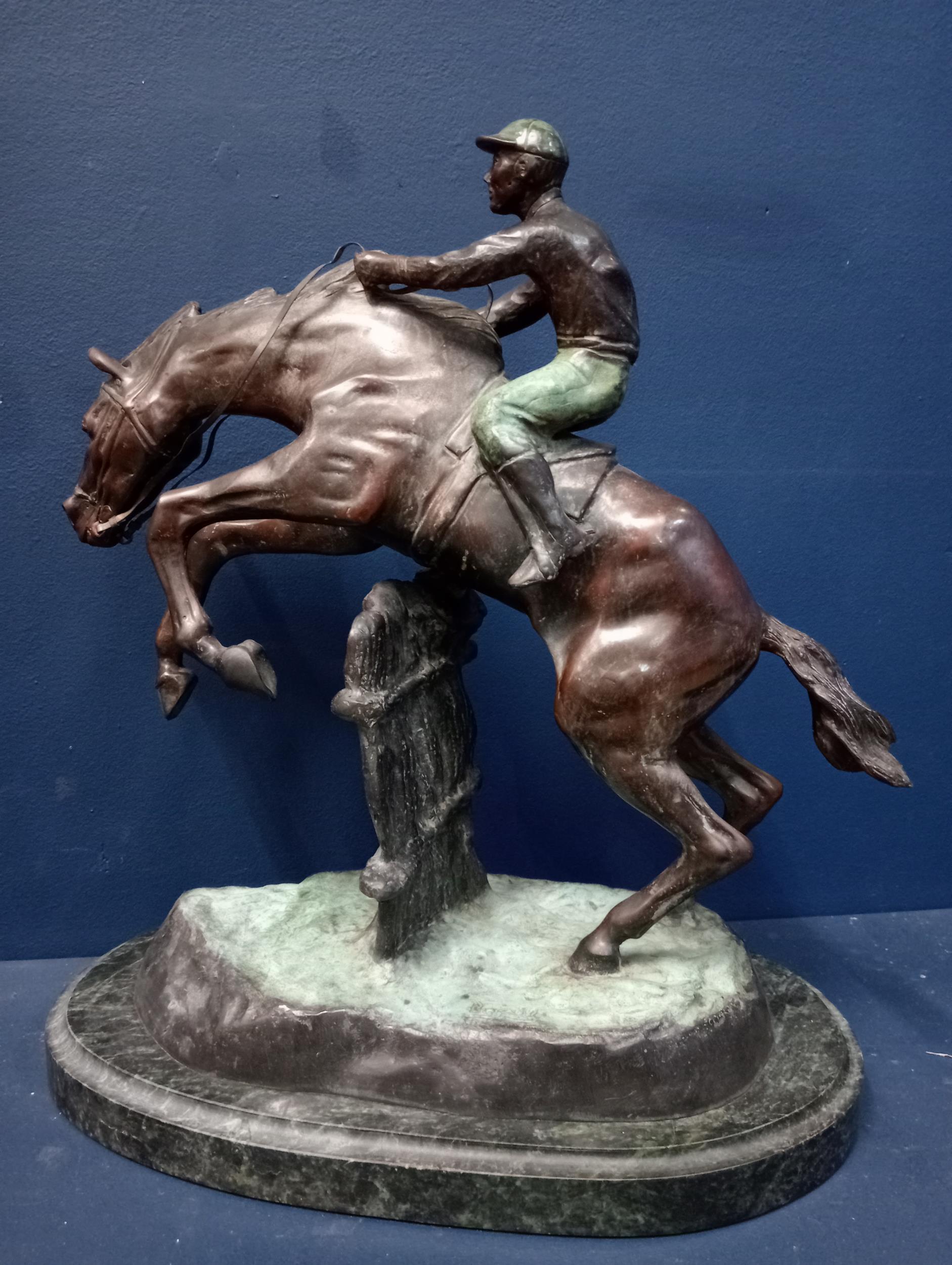 Bronze model of a horse and jockey mounted on marble base {H 43cm x W 36cm x D 22cm }. - Image 2 of 5