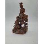 Carved Oriental hardwood figure. {28 cm H x 17 cm W x 8 cm D}.