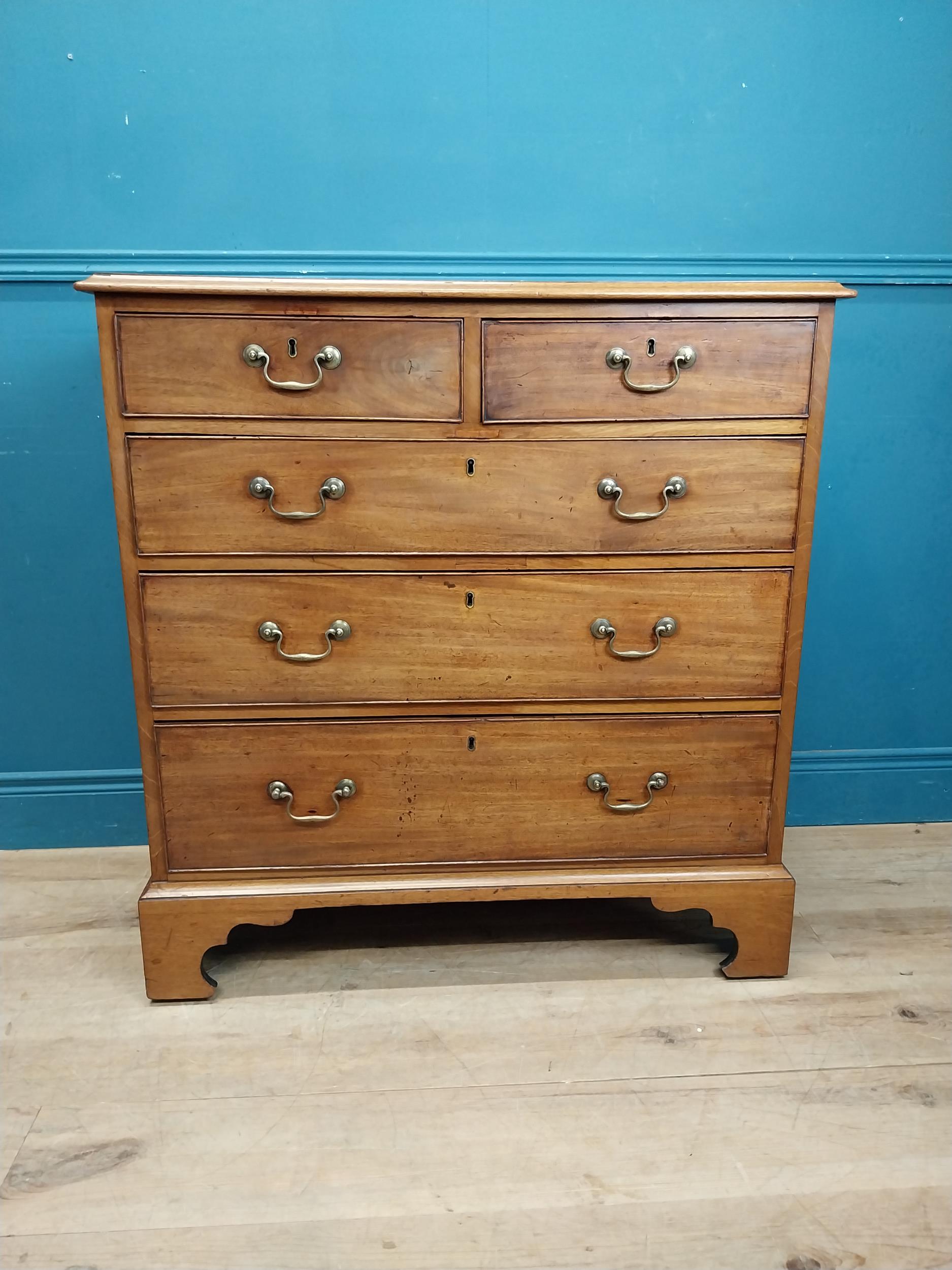 19th C. chest of drawers with three long drawers over two short drawers raised on shaped bracket